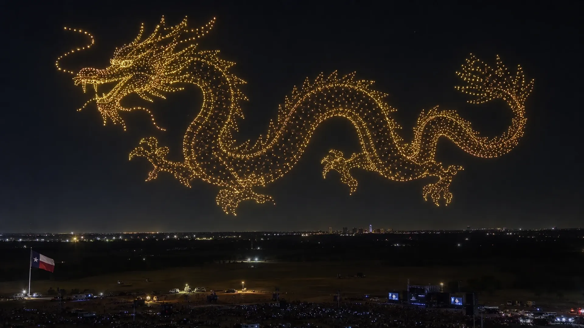 Thousands of drones forming a dragon in the night sky above a dark field in Texas
